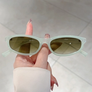 Fashionable oval mint green sunglasses with brown gradient lenses for women style