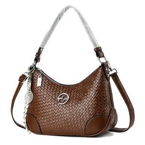Brown woven texture handbag with dual straps and a tennis racket charm for women