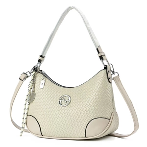 Chic cream woven crossbody bag with round metal logo and tennis racket charm