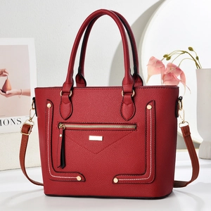 Chic red lychee grain leather tote bag with gold hardware and adjustable strap for women