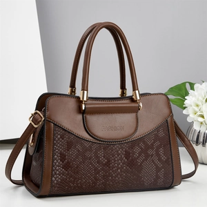 Large dark brown leather handbag with snake pattern texture and golden hardware details