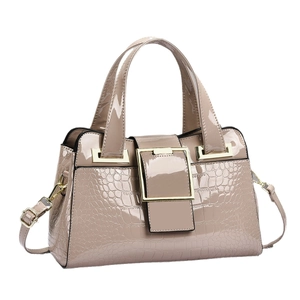 Elegant beige croc-embossed patent leather handbag with gold buckle and adjustable strap