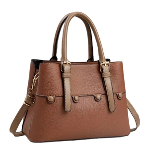 Large brown litchi pattern leather tote bag with gold hardware and shoulder strap