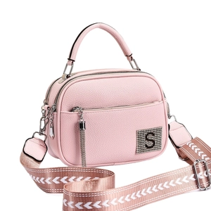 Pink lychee grain leather crossbody bag with sparkling S letter and wide woven strap