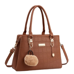 Brown crocodile pattern faux leather handbag with gold hardware and fur ball charm