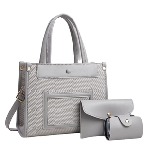 Minimalist light grey woven tote bag set with leather trim and matching pouches