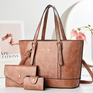 Three-piece brown PU leather handbag set including a large tote bag and two wallets