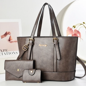 Three-piece set featuring large tote, wallet, and card holder in brown textured leather