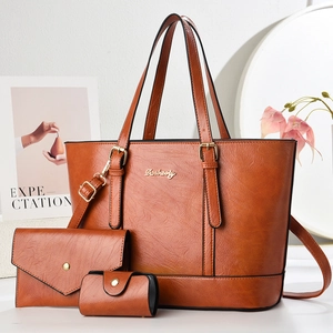 Detailed set of brown lychee-patterned PU leather tote bags with elegant gold hardware