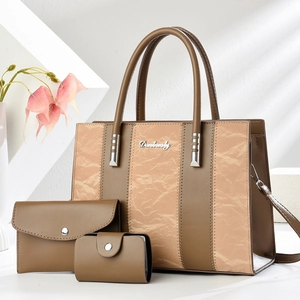 Three-piece tote bag set in brown faux leather with lychee texture and metal hardware