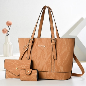 Three-piece caramel wrinkled leather handbag set including tote bag and envelope clutch