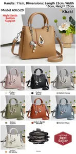 Detail view of large capacity PU leather bucket bag with inner compartments and pearl charm