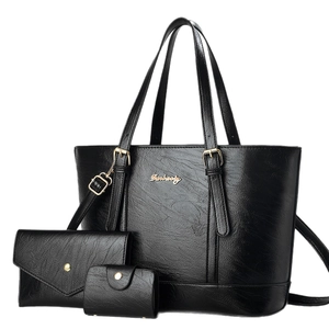 Three-piece black tote bag set with envelope wallet and coin purse in textured leather