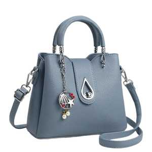 Dusty blue lychee texture bucket bag with shell charm and silver teardrop lock