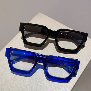 Detail of vintage thick square glasses frames in black and transparent blue finishes
