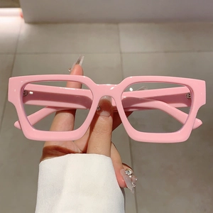 Pink thick frame rectangular eyeglasses for women with glossy finish hand-held shot