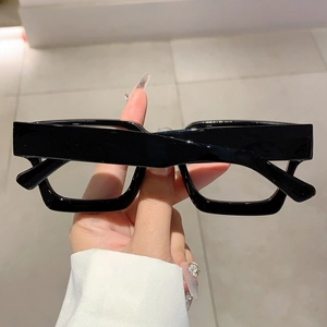Close-up of thick black square frames and wide temple design on retro blue light glasses
