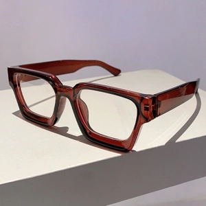 Detail of dark red transparent thick frame glasses with rectangular retro design
