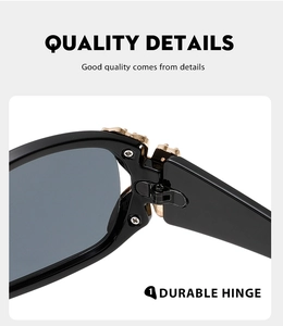 Close-up of durable golden metal hinges on elegant black butterfly-style sunglasses