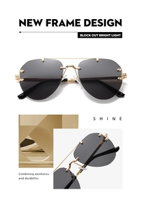 Detail einer randlosen Pilotenbrille mit goldenem Doppelsteg und Metallnieten