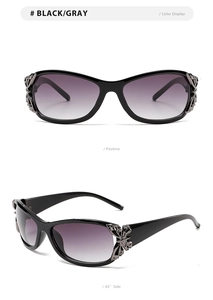 Detail of silver butterfly metal accent on black fashion sunglasses with gradient lenses