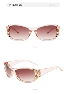 Detail of tea-colored sunglasses with elegant golden butterfly metal temple ornaments