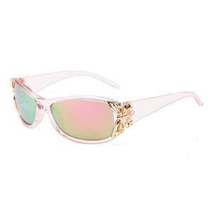 Pink transparent Y2K sunglasses with golden butterfly accents and gradient rainbow lenses