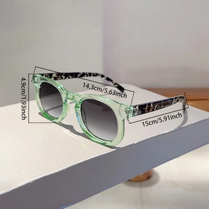 Detailed size specifications for round frame sunglasses with tortoiseshell temples