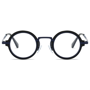 Vue détaillée des lunettes rétro rondes bleu marine et noir avec pont en métal chic