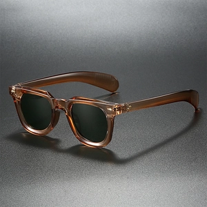 Retro amber tortoiseshell sunglasses with green lenses and metal rivet details