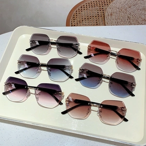 Collection of rimless gradient sunglasses with geometric hexagon lenses and gold temples