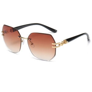 Frameless oversized gradient brown sunglasses with gold Greek key pattern on temple