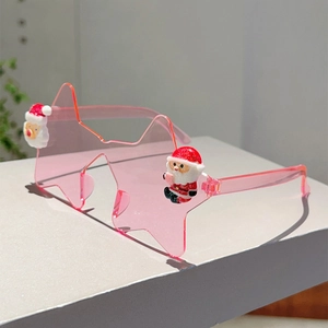 Détail macro de lunettes de Noël en forme d'étoile avec petite figurine Père Noël en 3D