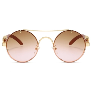 Detailed front view of gold double bridge sunglasses with 3D leopard head emblem