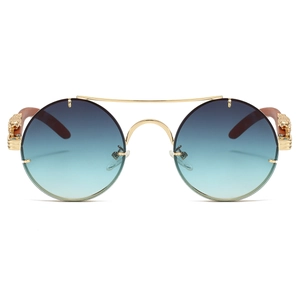 Detail of vintage double-bridge sunglasses featuring a gold leopard head relief on the temple