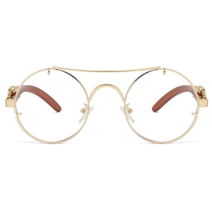 Detail of golden double bridge round glasses with leopard head hinges and wood grain temples