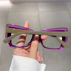 Detail of square purple transparent resin frame with contrasting olive green temples