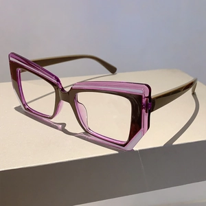 Detail of dual-layer cat-eye frames in dark brown and translucent purple finish