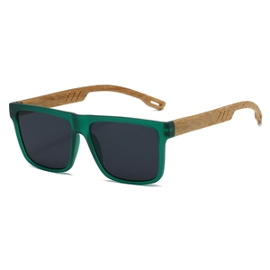 Detail of vintage square sunglasses with translucent dark green frame and wood grain temples