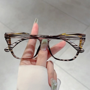 Close-up of tortoise shell cat-eye glasses frame with clear lens and inner temple details