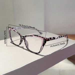 Detailed view of cat-eye eyewear frames with pink leopard print and size measurements
