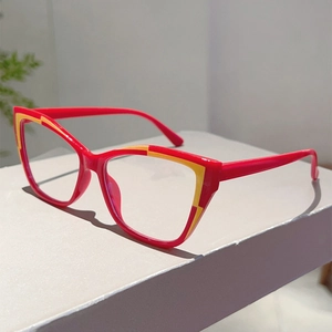 Detail of red and yellow cat eye glasses frames with a stylish retro two-tone design
