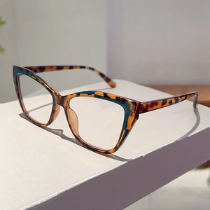 Detail view of cat eye frame featuring leopard pattern and navy blue color splicing