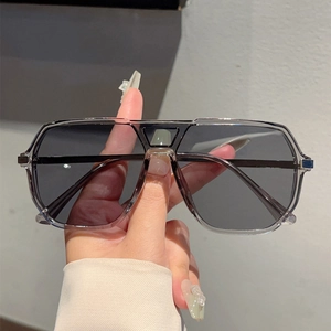 Fashionable oversized square pilot sunglasses with grey gradient lenses and clear grey frames