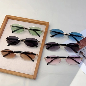 Detailed collection of rimless oval sunglasses in six colors with gold metal bridges