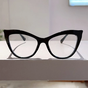 Detailed view of thick black cat-eye glasses frames with vintage oversized style