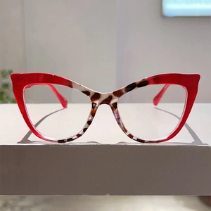 Detail of cat-eye eyewear frame with red and leopard print pattern design