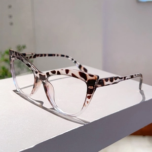 Side view of cat-eye glasses frame with leopard print and transparent lower rim