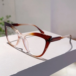 Macro shot of stylish cat-eye glasses frames with a brown to clear gradient finish