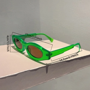 Detailed dimensions of green transparent sunglasses showing 15cm frame width and 14.7cm arms